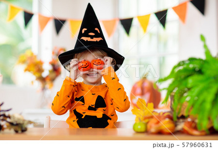 Child in Halloween costume. Kids trick or treat. 57960631
