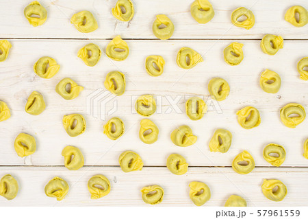 Spinach filled tortelloni on grey wood Spinach filled tortelloni on grey wood 57961559