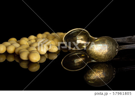 Raw yellow soya bean isolated on black glass 57961805