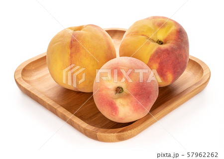 Fresh fuzzy peach isolated on white Fresh fuzzy peach isolated on white 57962262