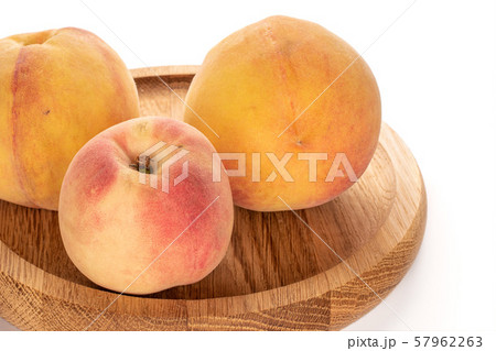 Fresh fuzzy peach isolated on white Fresh fuzzy peach isolated on white 57962263