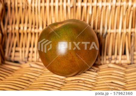 Fresh green red tomato with braided rattan Fresh green red tomato with braided rattan 57962360