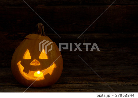 Halloween pumpkin with burning candle. Halloween pumpkin with burning candle. 57963844