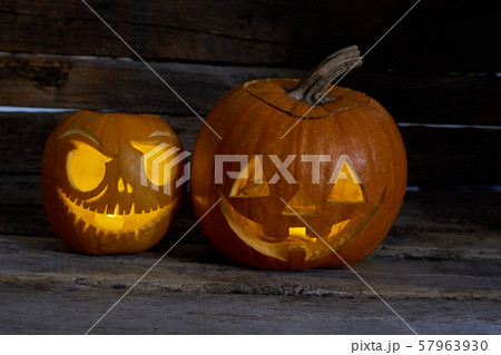 Two Halloween pumpkins on wooden background. Two Halloween pumpkins on wooden background. 57963930