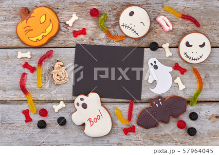 Treats for Halloween party on wooden background. 57964045