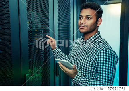 Serious nice man working in the information center Serious nice man working in the information center 57971721