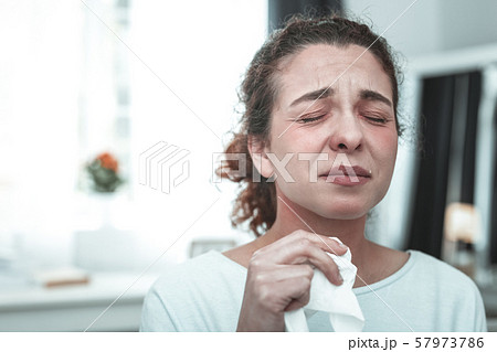 Wife crying while feeling allergic to much dusts at home 57973786
