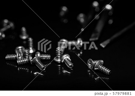 Black screws on a dark background Black screws on a dark background 57979881