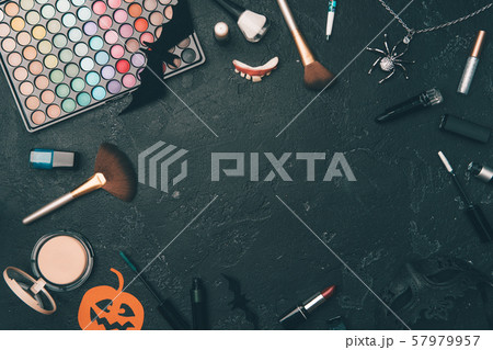 Photo of shadows, brushes, halloween spider, ghost on empty black background 57979957