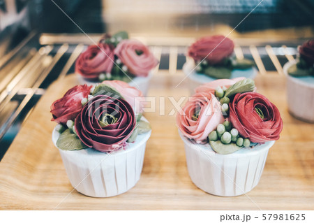 Close up of flower cupcakes in the cafe. 57981625