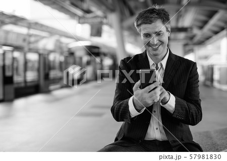 Businessman at the sky train station in Bangkok, Thailand 57981830