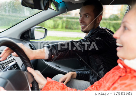 driving instructor urgently helps the student make 57981935