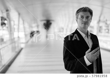 Businessman relaxing at the footbridge in Bangkok, Thailand Businessman relaxing at the footbridge in Bangkok, Thailand 57981958