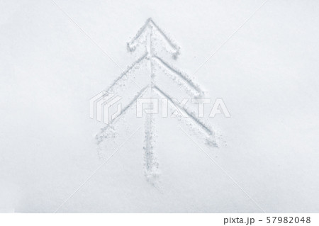 Background of Christmas tree painted on white snow. Copy space. Hand christmas tree drawing on snow Background of Christmas tree painted on white snow. Copy space. Hand christmas tree drawing on snow 57982048