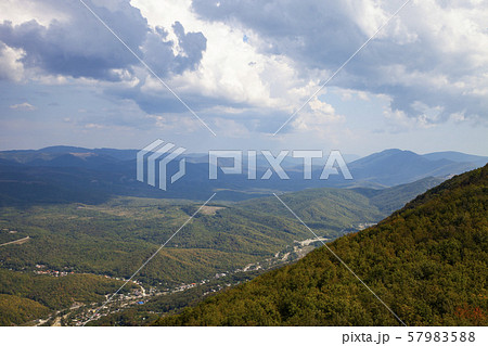 Beautiful view of the mountain peaks on a summer Beautiful view of the mountain peaks on a summer 57983588