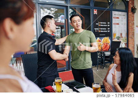 Meeting of friends in cafe Meeting of friends in cafe 57984065