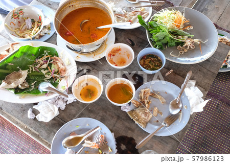 Leftover food on the wooden table. Leftover food on the wooden table. 57986123