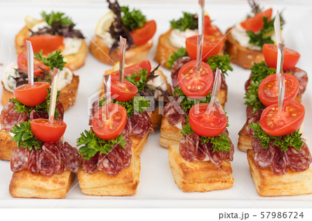 Close-up big plate with serving snack canapes Close-up big plate with serving snack canapes 57986724