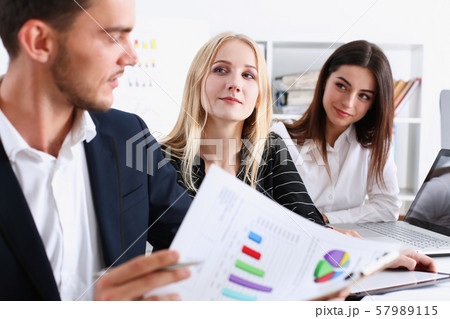 Group of people hold silver pen ready to make Group of people hold silver pen ready to make 57989115