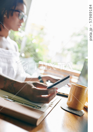 Woman paying online with credit card 57989184
