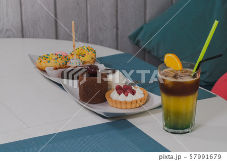 Appetizing desserts on a plate in a cafe. 57991679