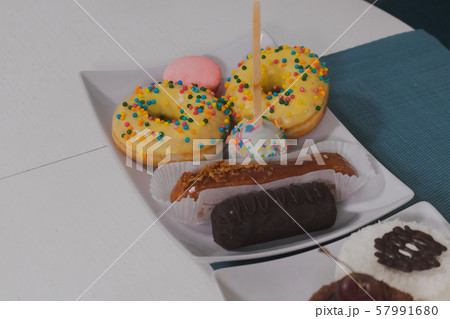 Appetizing desserts on a plate in a cafe. 57991680