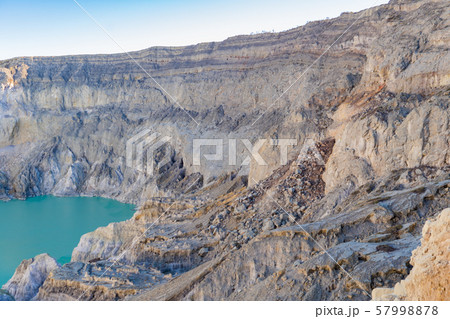Rock cliff at Kawah Ijen volcano with turquoise Rock cliff at Kawah Ijen volcano with turquoise 57998878