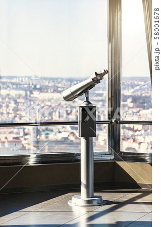 Telescope in observatory in Prague against window 58001678
