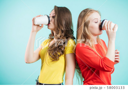Two friends enjoy a morning coffee 58003133