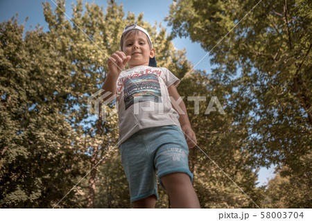 A young boy in central park of Moldova 58003704