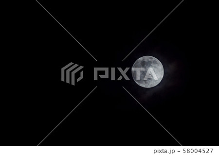Mystic full moon in night sky with clouds Mystic full moon in night sky with clouds 58004527