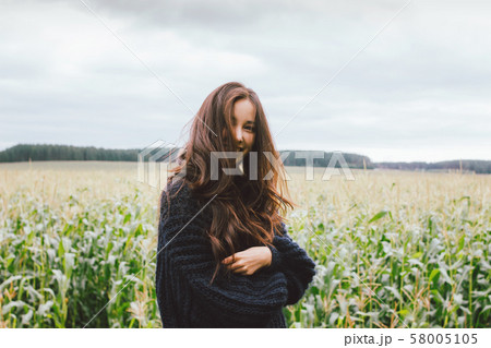 Beautiful carefree long hair asian girl in knitted 58005105