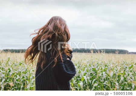 Beautiful carefree windy long hair girl in knitted Beautiful carefree windy long hair girl in knitted 58005106