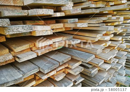 background of sawn boards in a stack. lumber 58005137