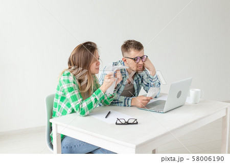 Upset husband and wife consider the total costs of payments and purchases made over the past month 58006190