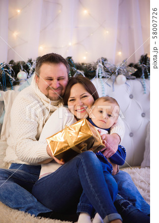 Beautiful family enjoying their holiday time together and having fun Beautiful family enjoying their holiday time together and having fun 58007726