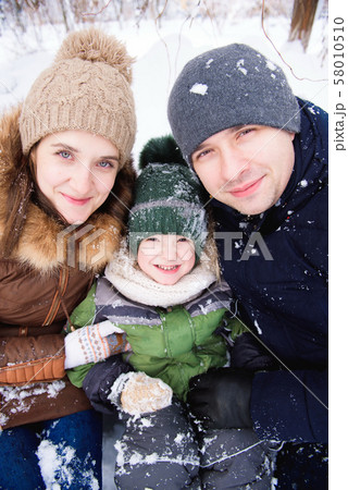 family mother and child having fun, playing at winter walk outdoors family mother and child having fun, playing at winter walk outdoors 58010510