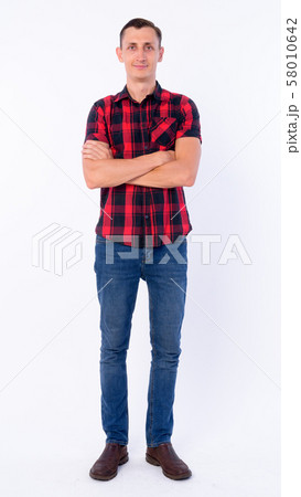 Full body shot of hipster man with arms crossed Full body shot of hipster man with arms crossed 58010642