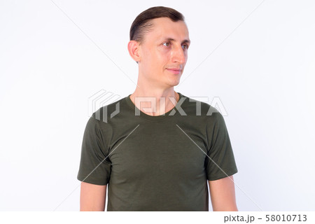 Studio shot of man thinking and looking away 58010713