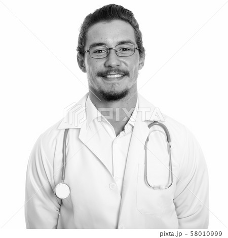 Close up of young happy man doctor smiling with eyeglasses isolated against white background 58010999