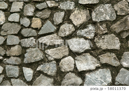 Old rough stone wall. Rock gray background. 58011370