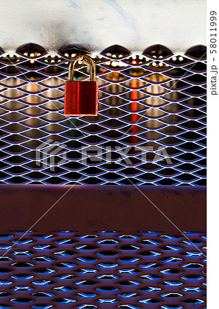 Red shiny padlock by night 58011999