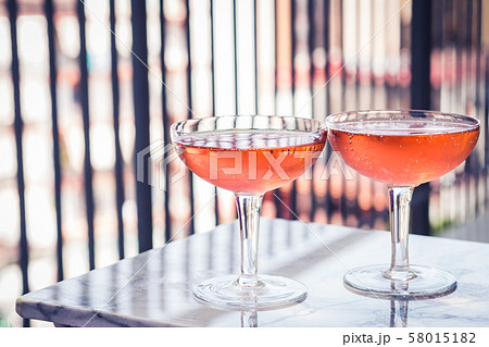 Two crystal stemmed glasses with rose wine Two crystal stemmed glasses with rose wine 58015182