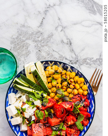 Chickpea watermelon salad with feta and tomatoes Chickpea watermelon salad with feta and tomatoes 58015205