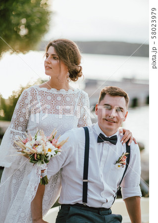 Happy newly married couple, smiling bride brunette 58023979