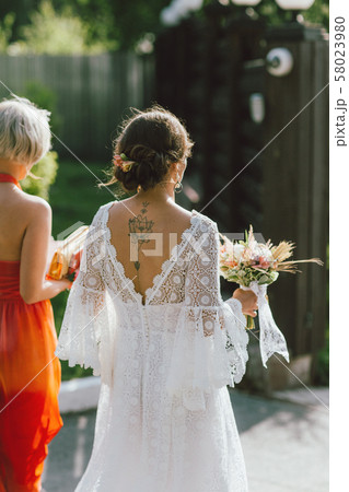 The happy bride and her best friend at wedding 58023980