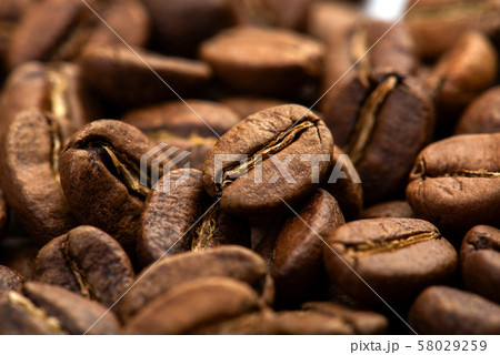 Coffee beans close-up background. Fresh roasted 58029259