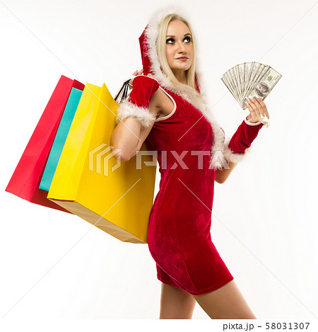 A beautiful sexy girl in a New Year's dress, hold 58031307