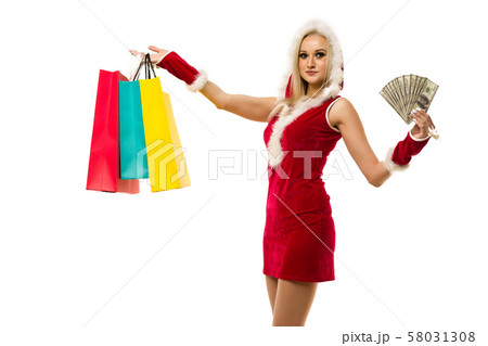 A beautiful sexy woman in a New Year's dress, hold A beautiful sexy woman in a New Year's dress, hold 58031308