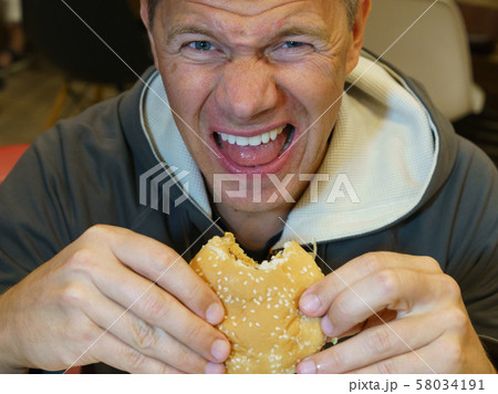 Fast food eating Fast food eating 58034191